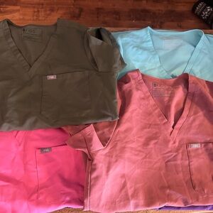 Figs Scrub Tops in Olive, Sky Blue, Pink, and Coral
